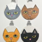 four different cat ornaments - front side